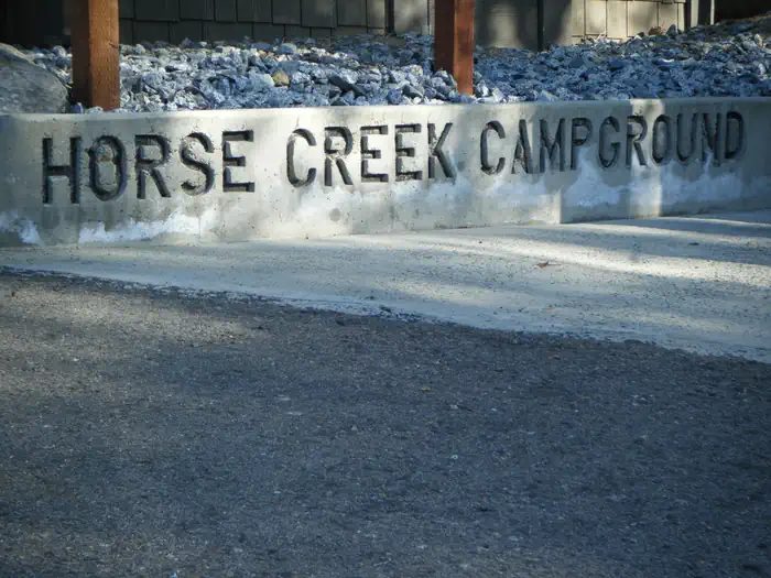 Campground sign in front of Fee Building/Registration