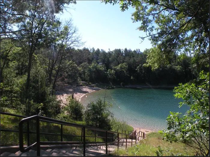 A view of Kneff Lake and the Kneff Lake Day Use area beach from a staircase