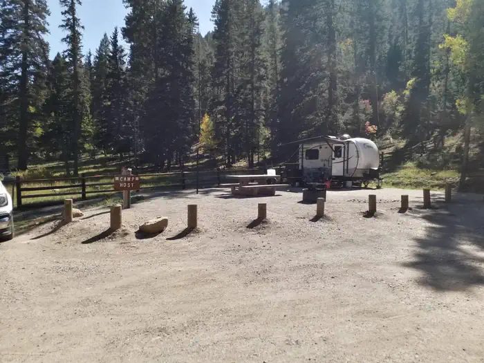 A camper in the campground parking area