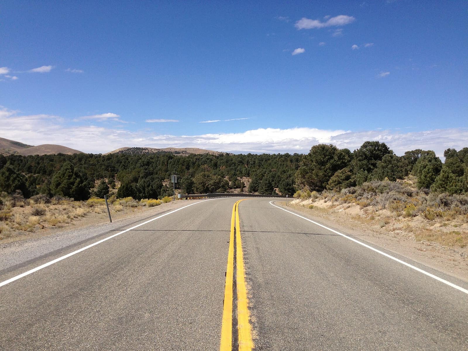 U.S. Route 50 through the pinyon and juniper woodland near Bob Scott Summit, beside the campground