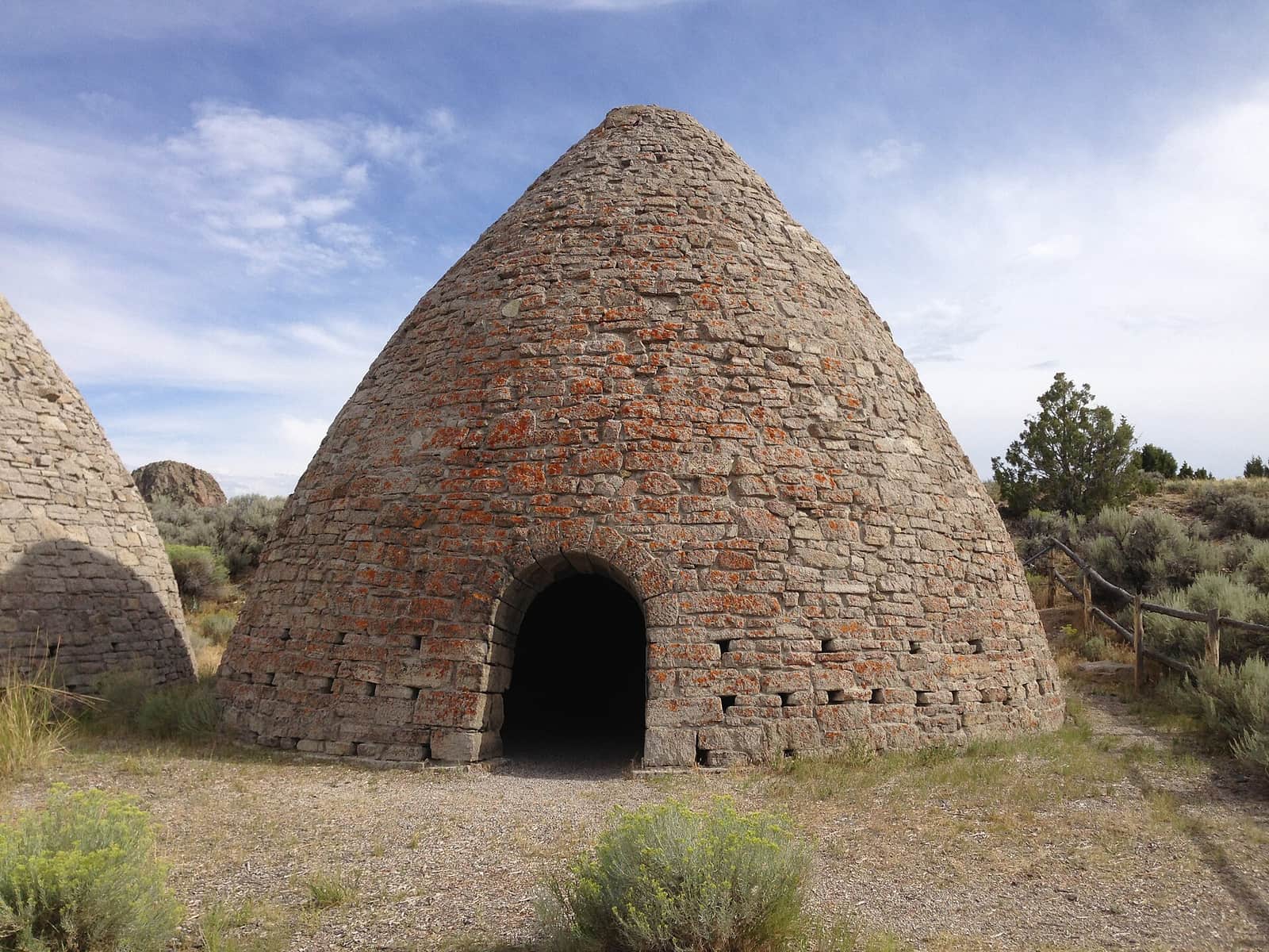 Close view of one of the stone beehive ovens and its arched doorway