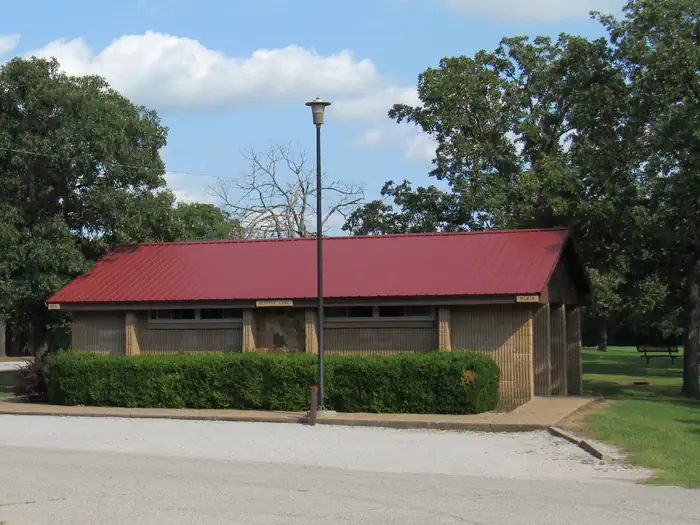 Main restroom and shower facility located in the middle of the campground adjacent to the group shelter and the playground