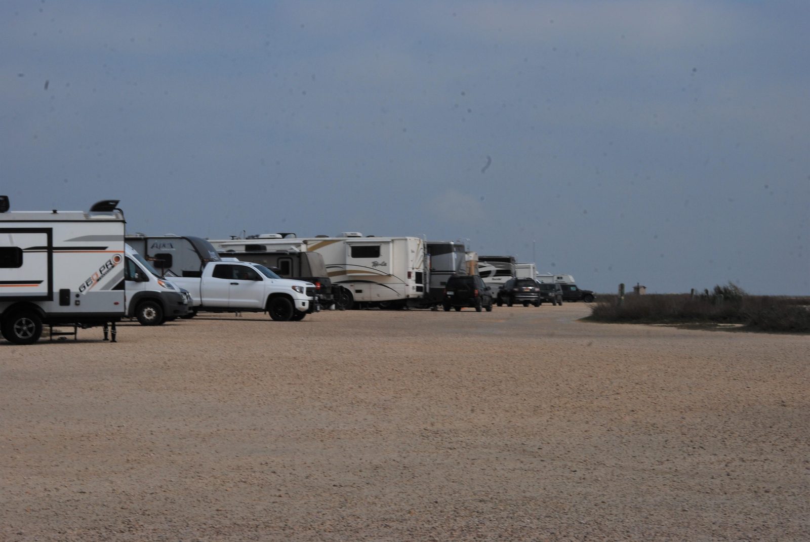 Camping side by side with unobstructed views of Laguna Madre, its wildlife and windsurfers