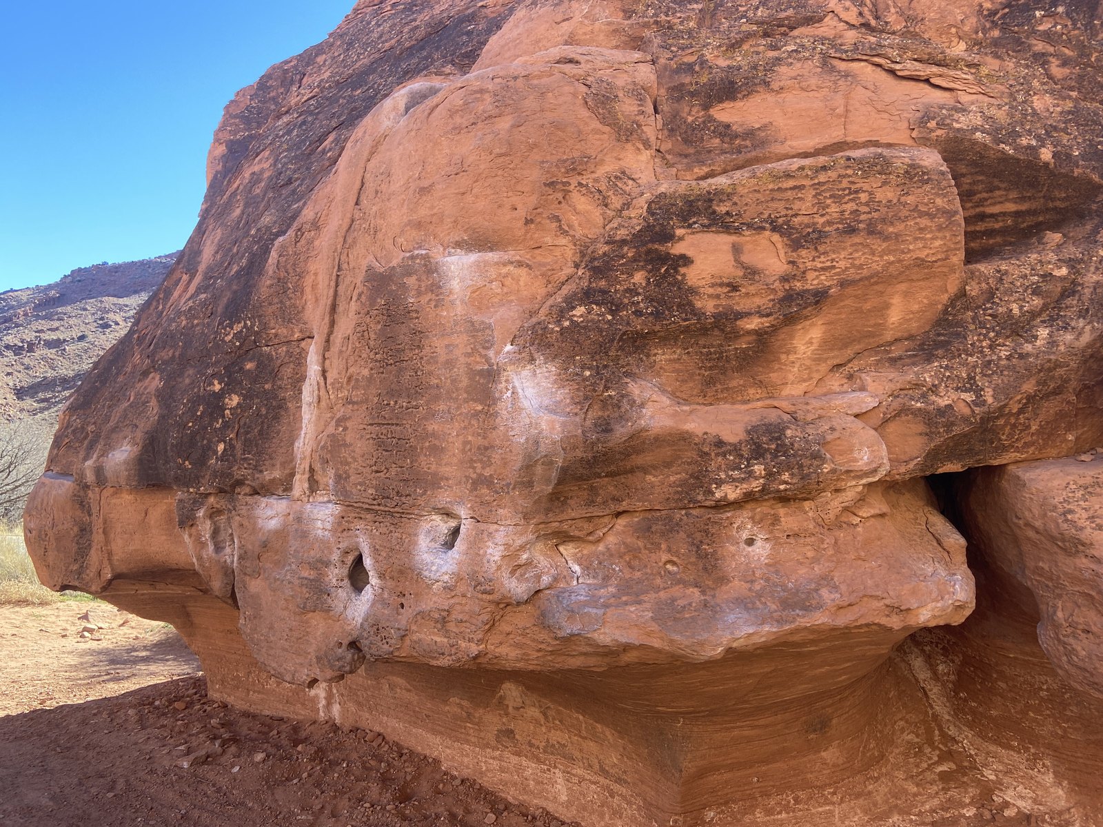 A sandstone boulder with climbing holds at the Big Bend Bouldering Area near the campground