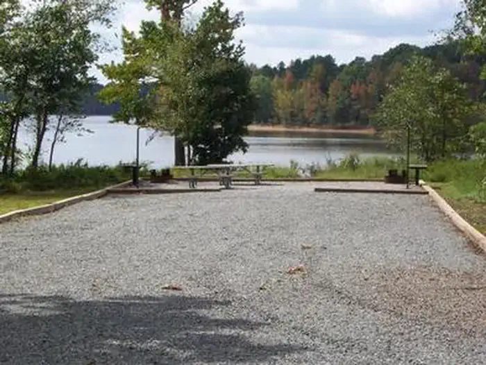 This is a picture of a double site. This site does not have electricity or water. Most campsites are graveled. This campsite has double of everything
