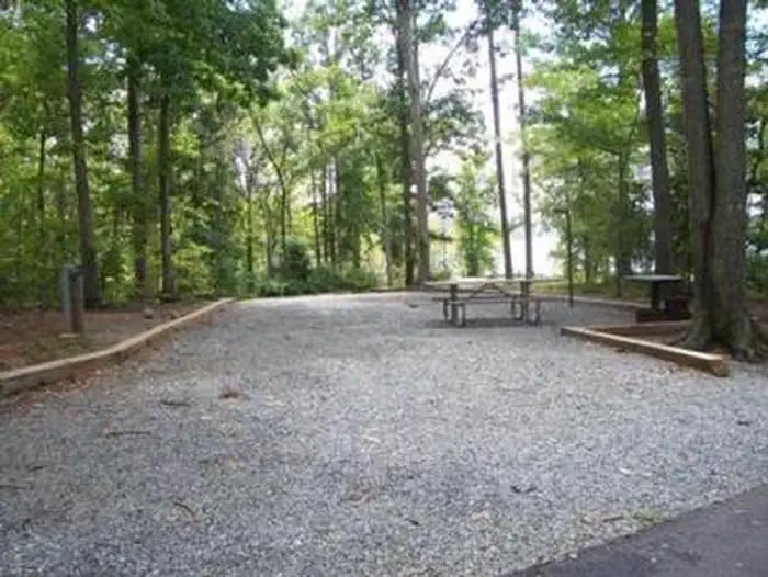 This is another campsite in Longwood. This site has a picnic table, utility table, grill/fire ring, lantern post and electric pedestal and water spigot