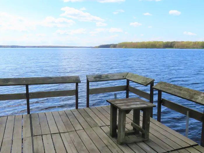 Accessible fishing pier and view of lake