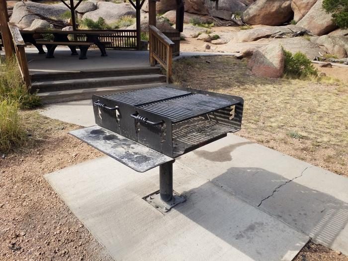 Rotatable grill with 28"x36" of cooking area and a 12"x36" shelf. Cooking height is adjustable